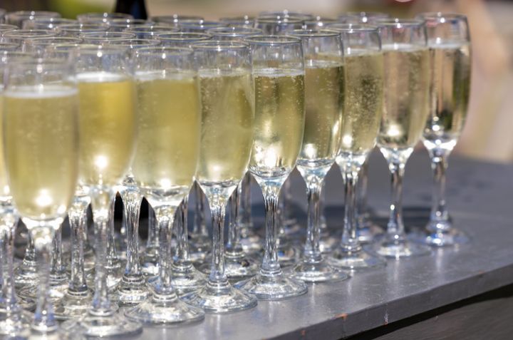 a close - up view of glasses of champagne with the rest empty