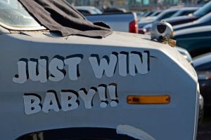 A van parked in the coliseum parking lot has the words "Just Win Baby!!" displayed on it's fender before the Oakland Raiders vs. St. Louis Rams preseason game at O.co Coliseum in Oakland, Calif., on Friday, Aug. 14, 2015. (Jose Carlos Fajardo/Bay Area New