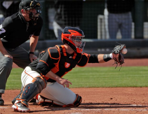 Buster Posey (28) behind the plate in the second inning as the San Francisco Giants played the Chicago White Sox in a spring training game at Scottsdale Stadium in Scottsdale, Ariz., on Thursday, March 4, 2021