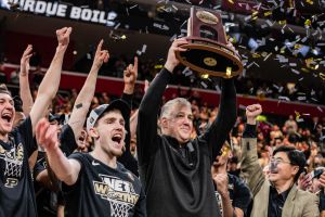 The Purdue Boilermakers celebrate after their victory...