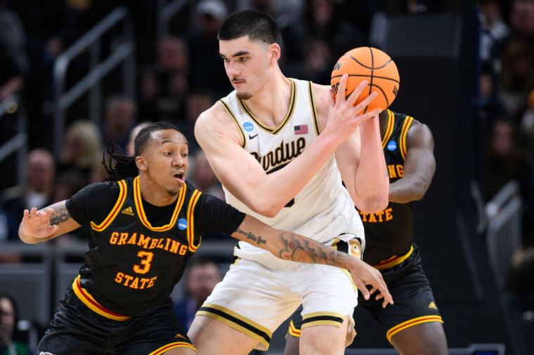 Photos of Zach Edey Because He Is "Just Tall"