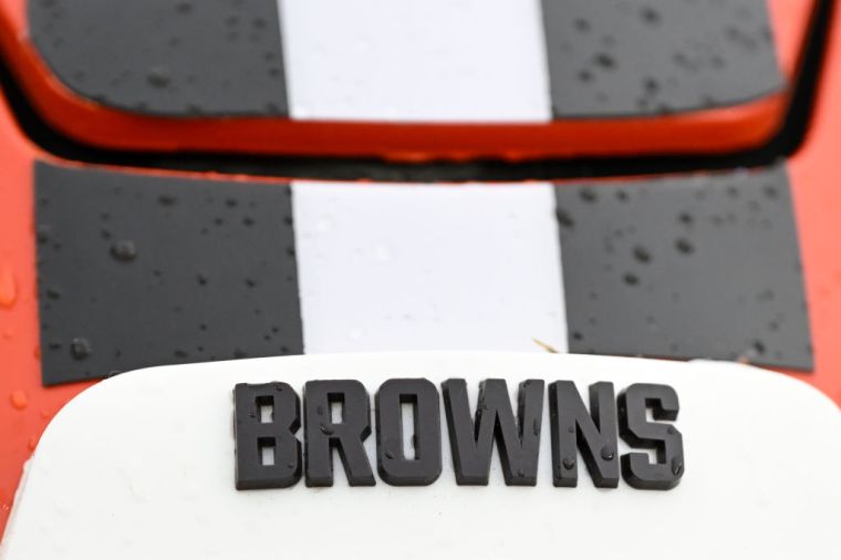 Cleveland Browns - back in the day of leather helmets the Cleveland Browns would where white helmets during day games but they would paint their leather helments organce during night games because they current where white helmets because a white ball was used during night games