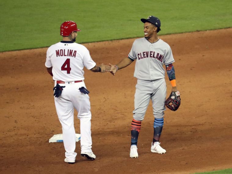 Yadier Molina #4 and Francisco Lindor #12