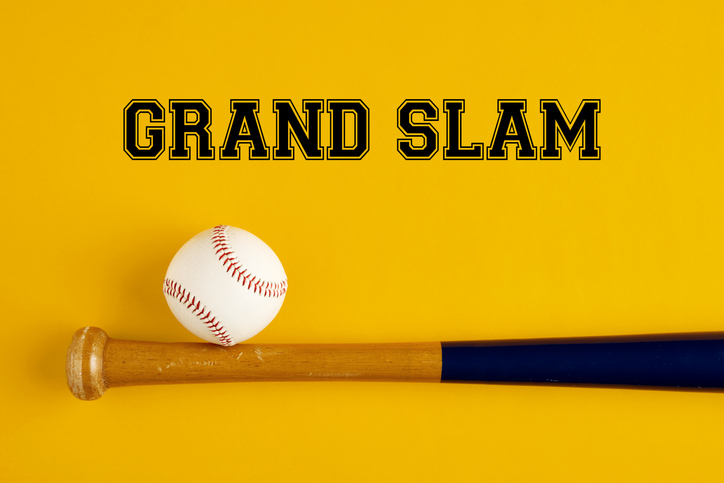 Baseball bat and a ball on yellow background with the word grand slam