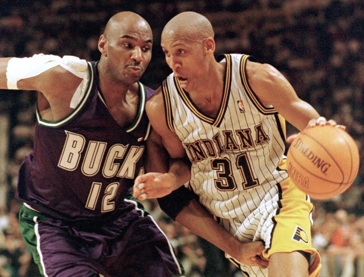 Indiana Pacers forward Reggie Miller (R) heads for