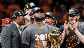 Cleveland Cavaliers' LeBron James holds the the Larry O’Brien NBA Championship Trophy after defeating Golden State Warriors 93 to 89 in Game 7 of the NBA Finals at Oracle Arena on Sunday, June 19, 2016 in Oakland, Calif