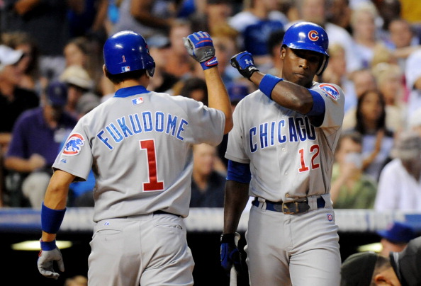 Chicago Cubs Kosuke Fukudome and Alfonso Soriano celebrate the Fukudome's Home Run from Jhoulys Chachin in the 7th inning of the game against Colorado Rockies at Coors Field on Saturday. Chicago won 6-5. Hyoung Chang/ The Denver Post