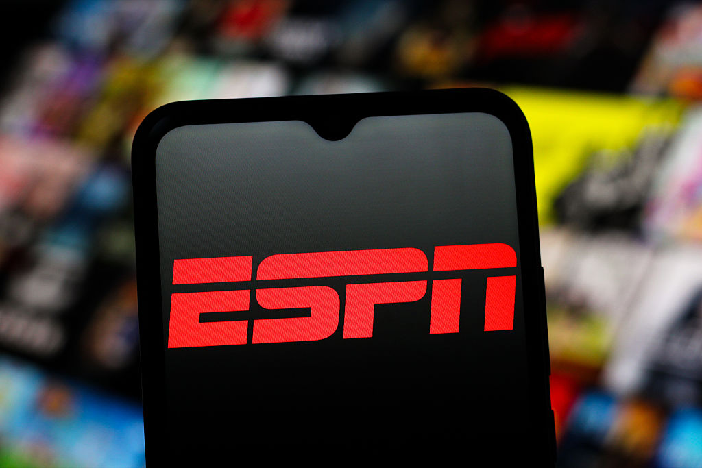In this photo illustration, the ESPN (Entertainment and...