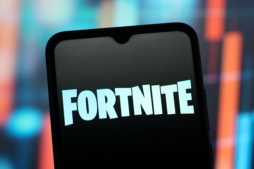 In this photo illustration, the Fortnite logo is seen...