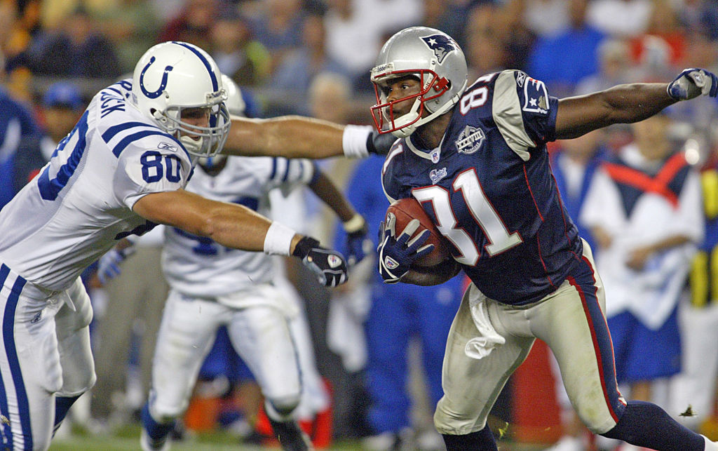 (9/9/04 Foxboro,MA) New England Patriots vs Indianapolis Colts. Bethel Johnson makes his way down field trying to keep away from Ben Hartsock in the 2nd quarter. (C16E9157.JPG Staff photo by Matt Stone Saved in Friday)