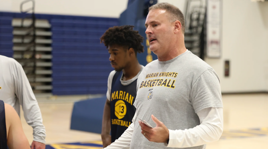Marian coach Pat Knight talks to his team during practice. | Marian Athletics