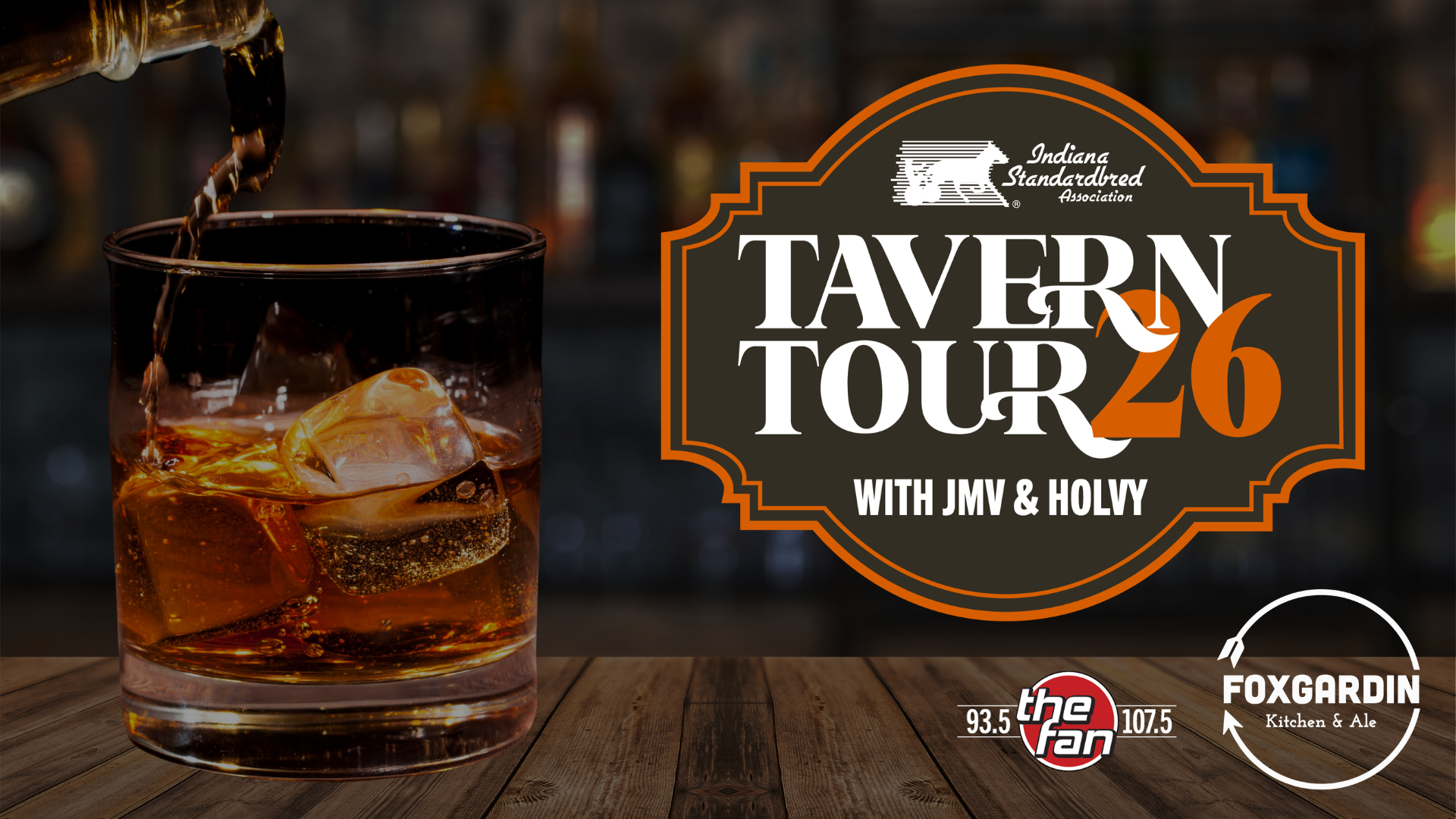 A glass of whiskey on the rocks with the "Tavern Tour 26" logo and branding for The Fan radio station and Foxgardin Kitchen & Ale.