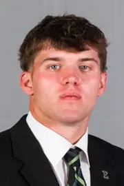 Portrait of a young man in a suit and tie.
