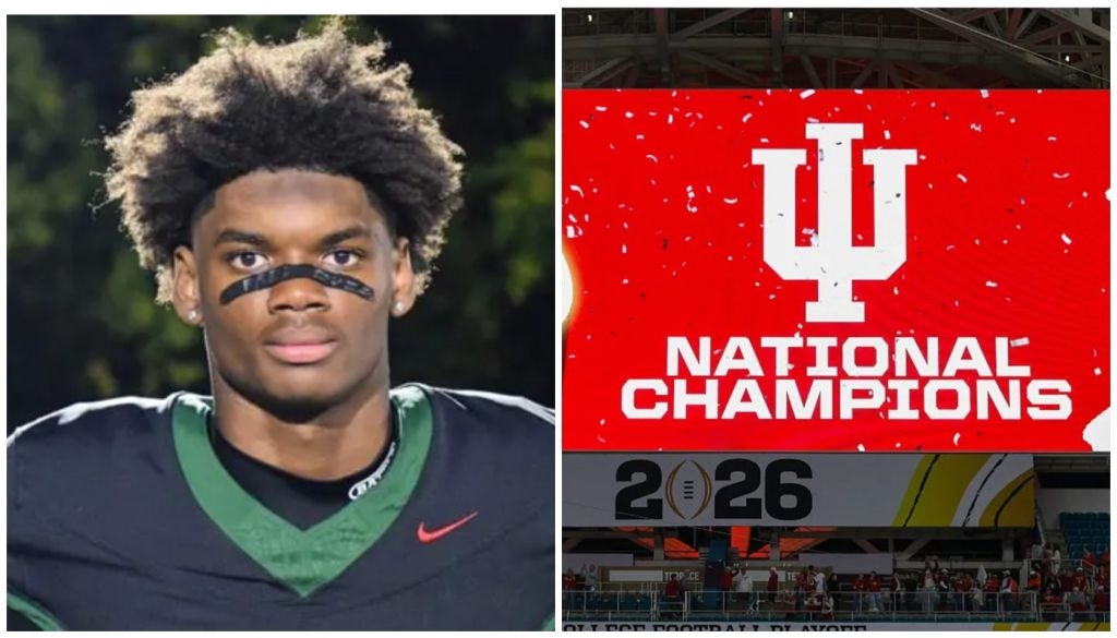 A young Black man in a green football jersey stands on a field. In the background, a large red banner displays "NATIONAL CHAMPIONS" and the Indiana University logo.