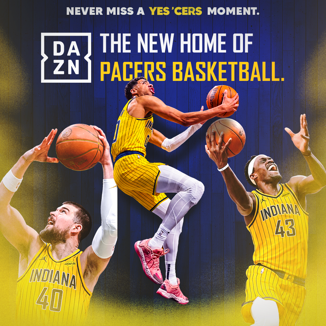 A basketball player in a yellow jersey leaping to shoot the ball, surrounded by other players in yellow jerseys with the text "Indiana" on them.