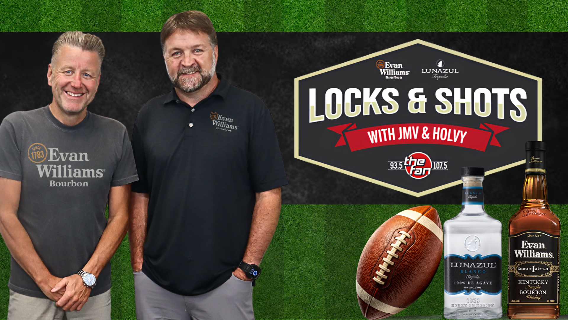 Two men wearing Evan Williams Bourbon and Lunazul Tequila apparel standing in front of a "Locks & Shots with JMV & Holvy" radio show banner on a grassy background.